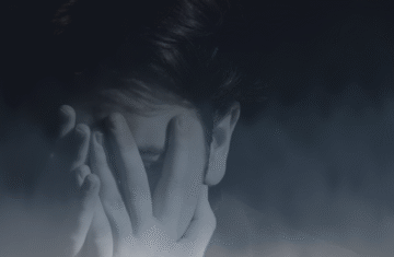 Shame and Guilt, Person covering their face in fog