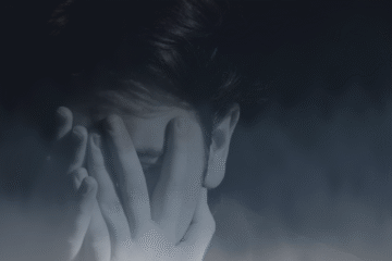 Shame and Guilt, Person covering their face in fog