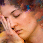 Woman with palm on face because of cruel inner dialogue